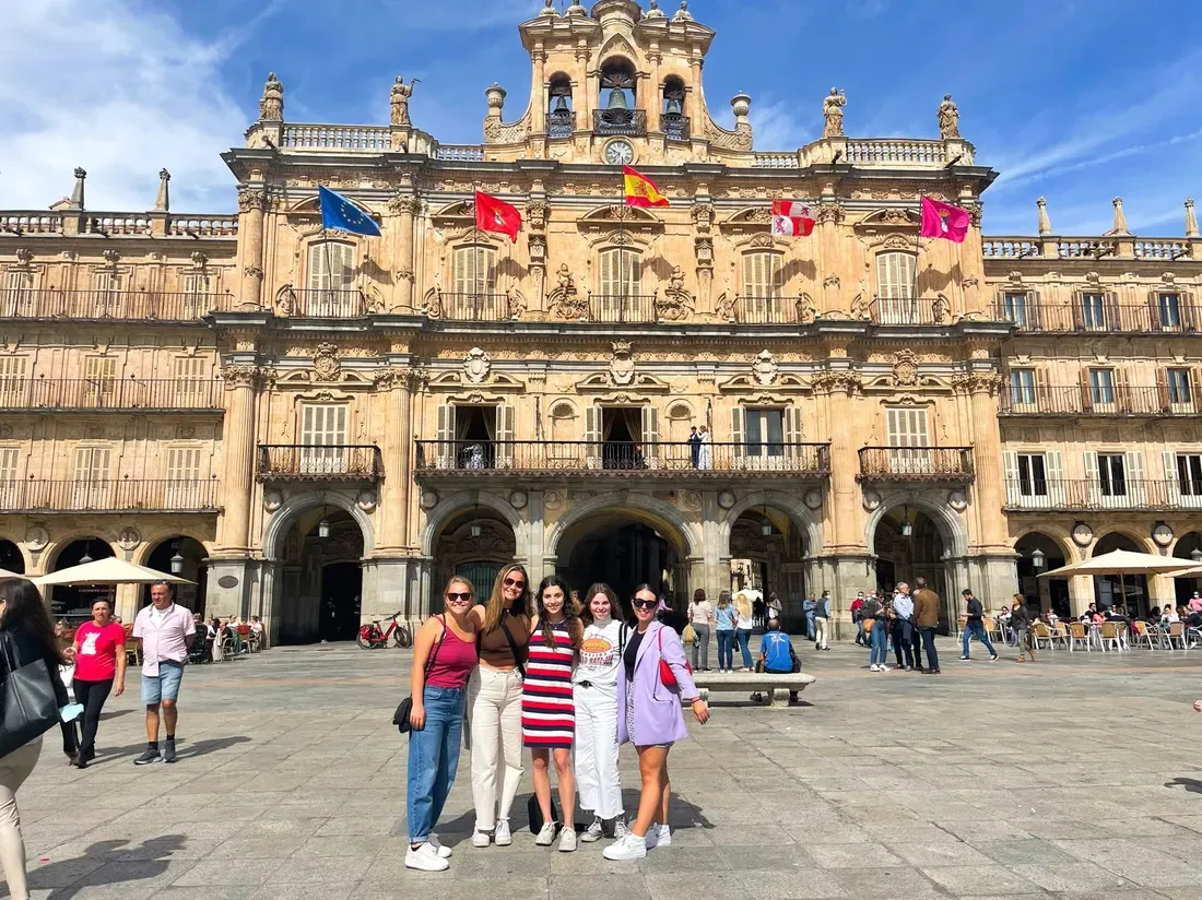 Students standing outside the Salamanca Plaza Mayor in Madrid, Spain.